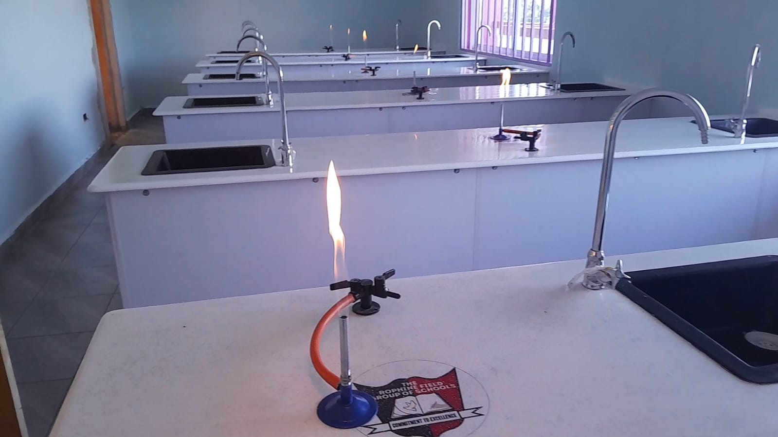 Science lab with bunsen burner flame demonstration